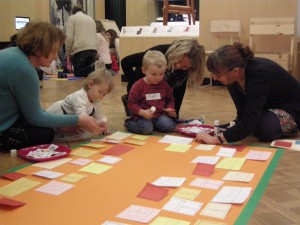 Making our own museum by sticking pictures under the lift-the-flap display cases.