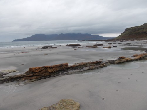 On the deserted beach with a view of Rhum